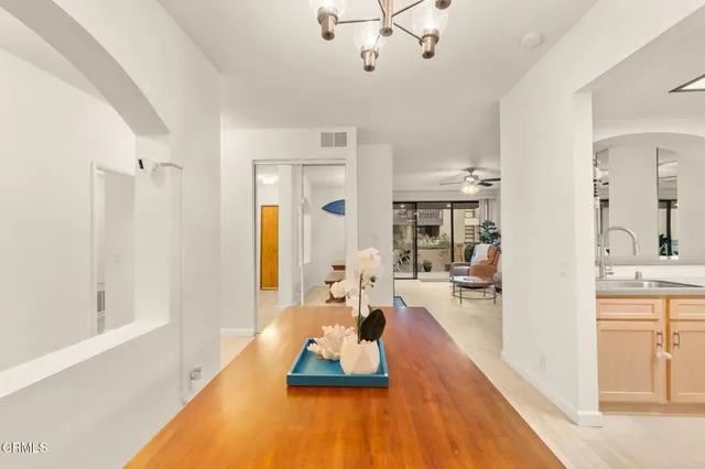 a view of a living room and chandelier