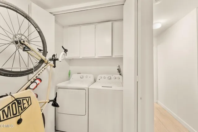 a view of a patio with table and chairs potted plants