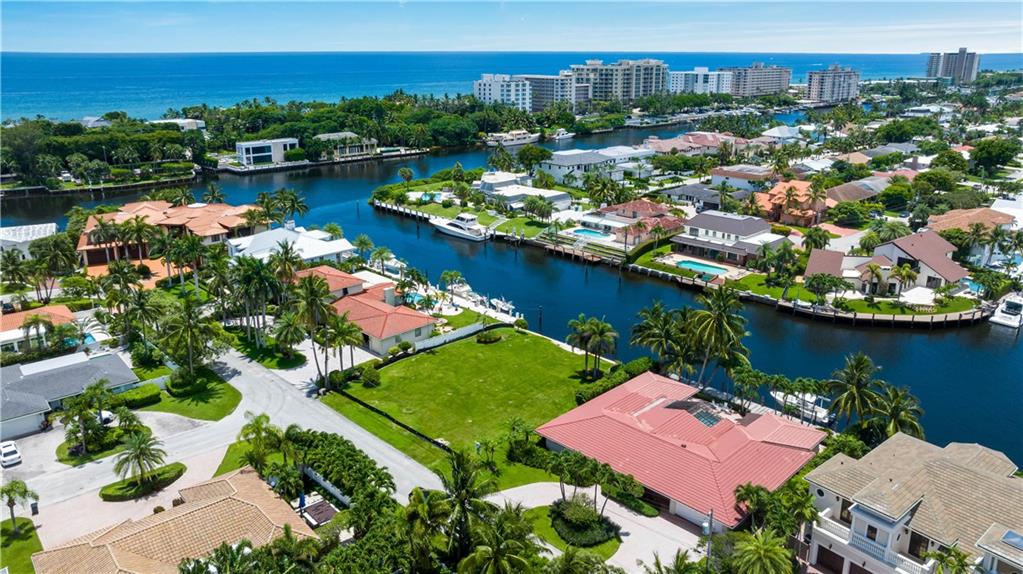 an aerial view of a house with a lake view