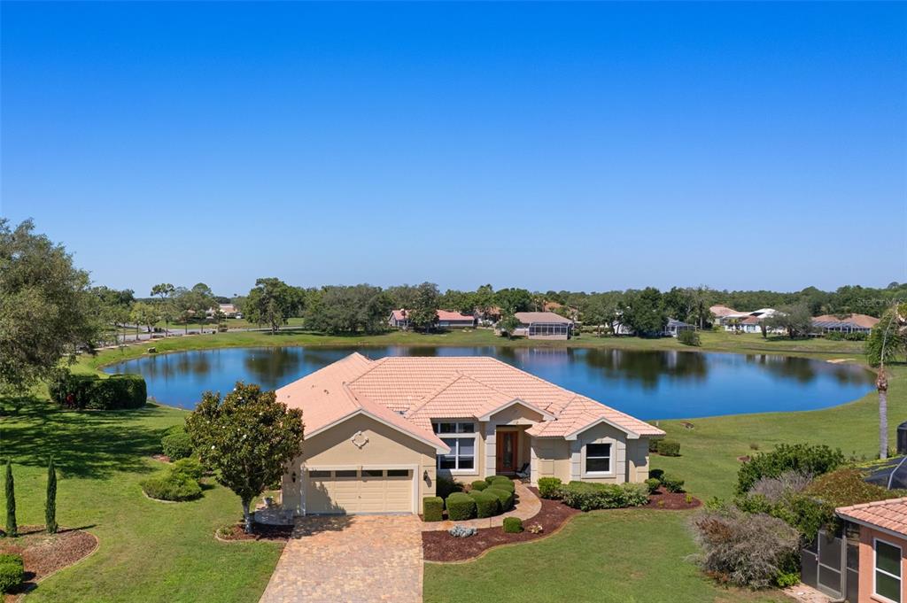 10081 Georgetown Court Weeki Wachee, FL 34613 - Photo 2 of 76 an aerial view of a house with outdoor space lake and lake view