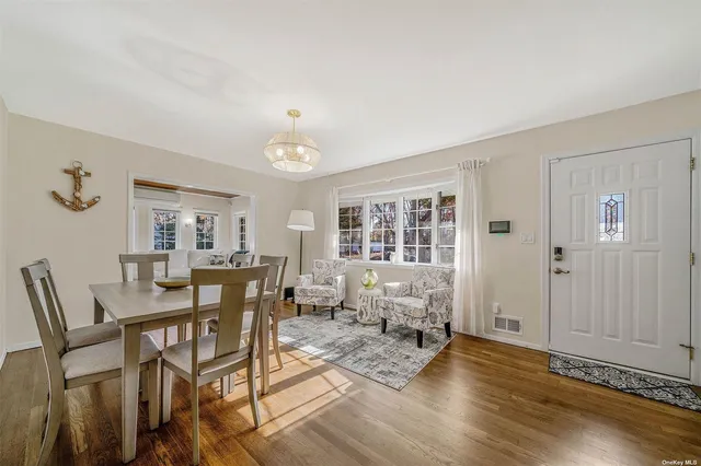 a view of a livingroom with furniture and wooden floor