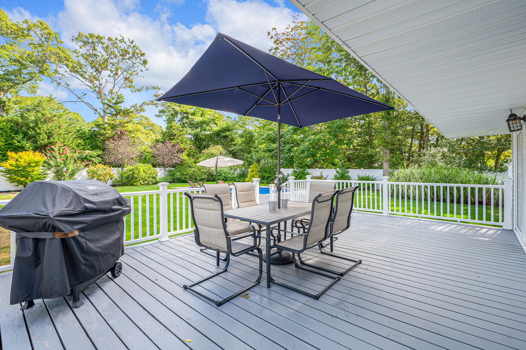 6 Rolling Hill Road Hampton Bays, NY 11946 - Photo 22 of 28 a view of a table and chair on the wooden floor