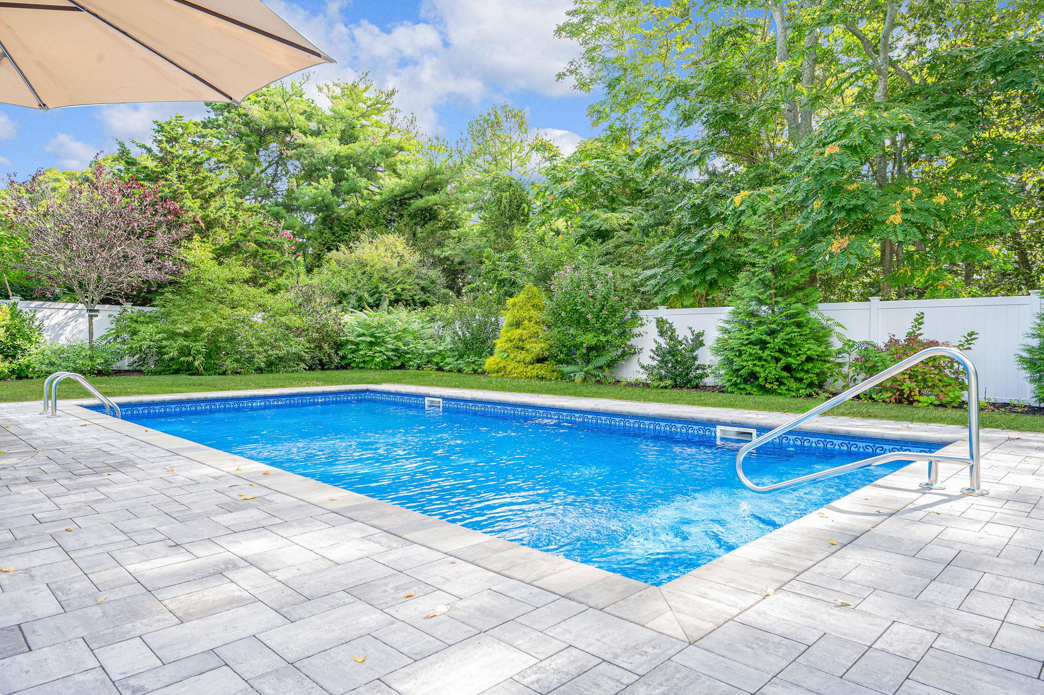 6 Rolling Hill Road Hampton Bays, NY 11946 - Photo 23 of 28 a view of an outdoor space pool patio and yard