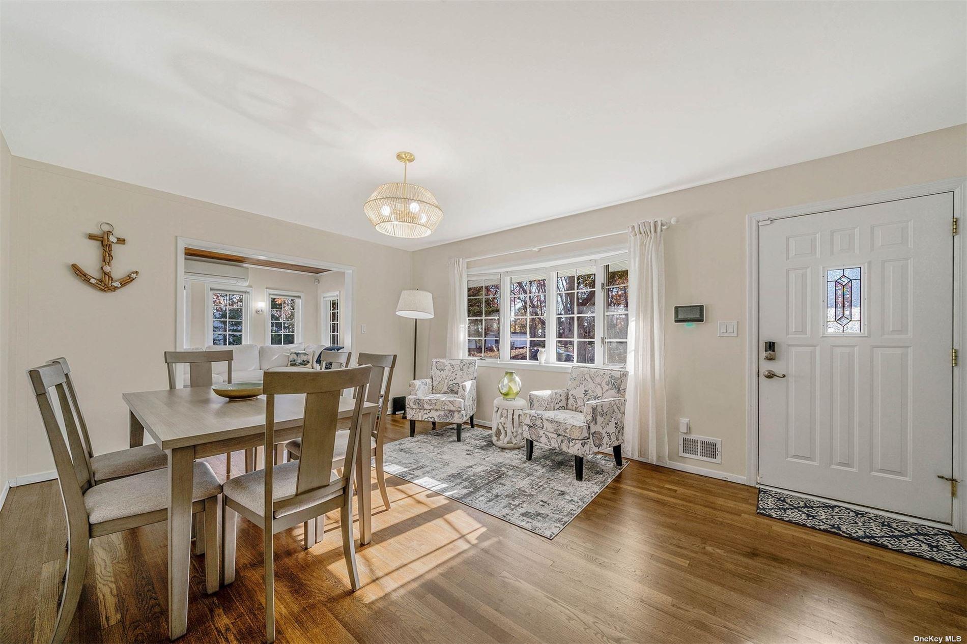 6 Rolling Hill Road Hampton Bays, NY 11946 - Photo 3 of 28 a view of a livingroom with furniture and wooden floor