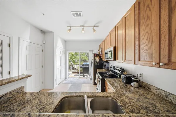 a kitchen with a large window and a sink