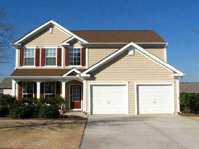 129 Diamond Ridge Avenue Canton, GA 30114 - Photo 1 of 1 a front view of a house with a yard