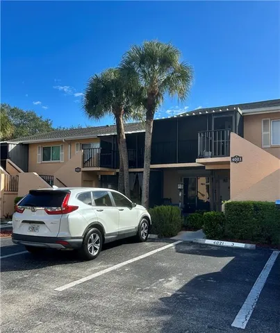a view of a car parked in front of a house