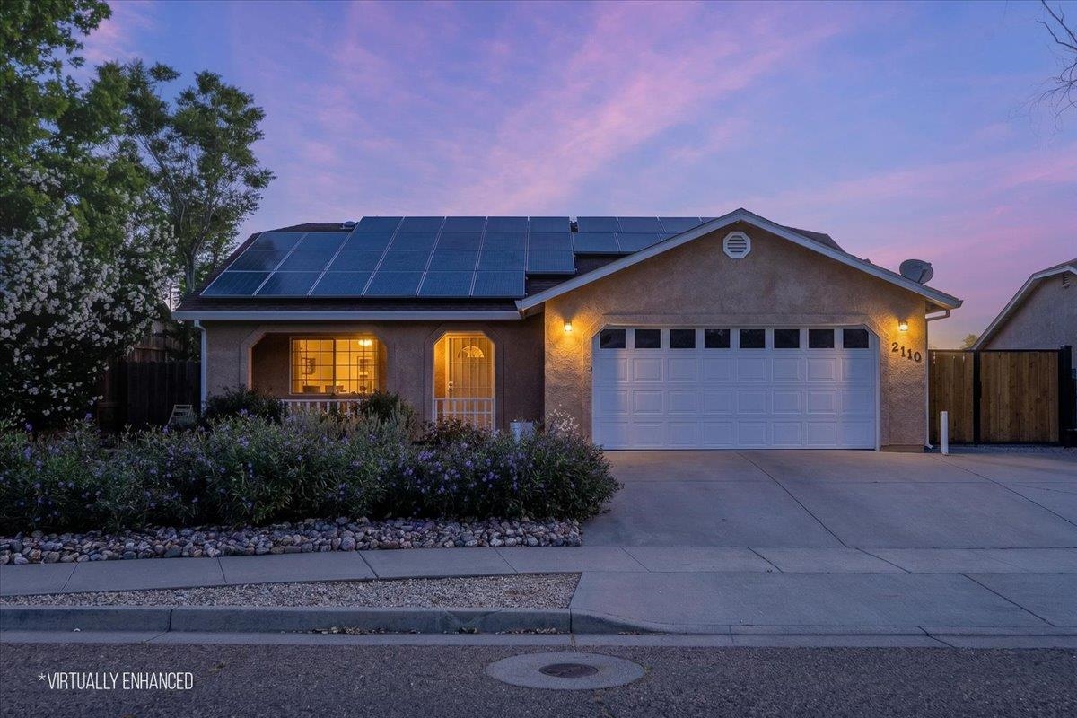 2110 Gentry Way Red Bluff, CA 96080 - Photo 1 of 47 a front view of a house with a yard and garage