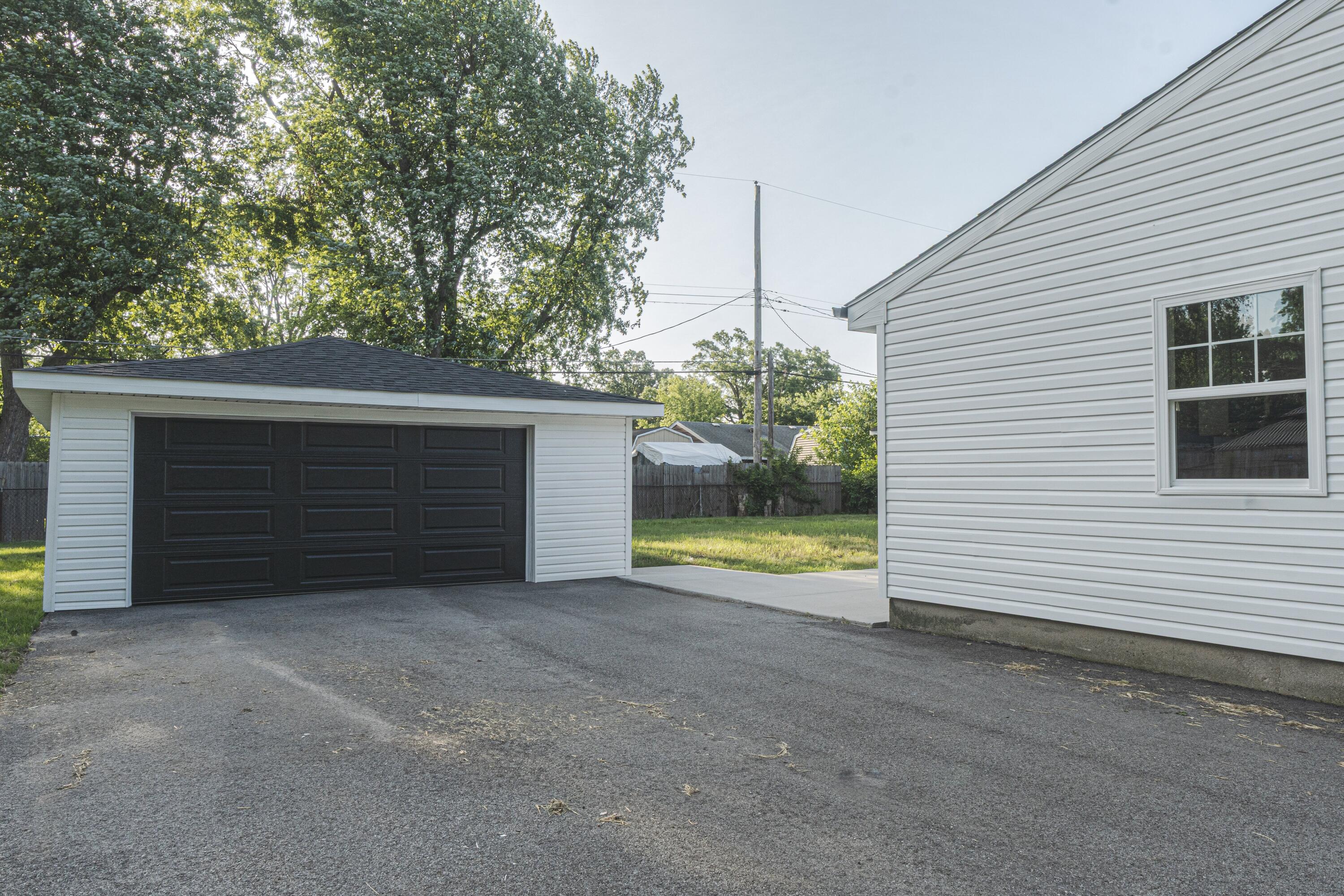 719 Imperial Road Valparaiso, IN 46385 - Photo 12 of 12 a view of a house with a yard and garage