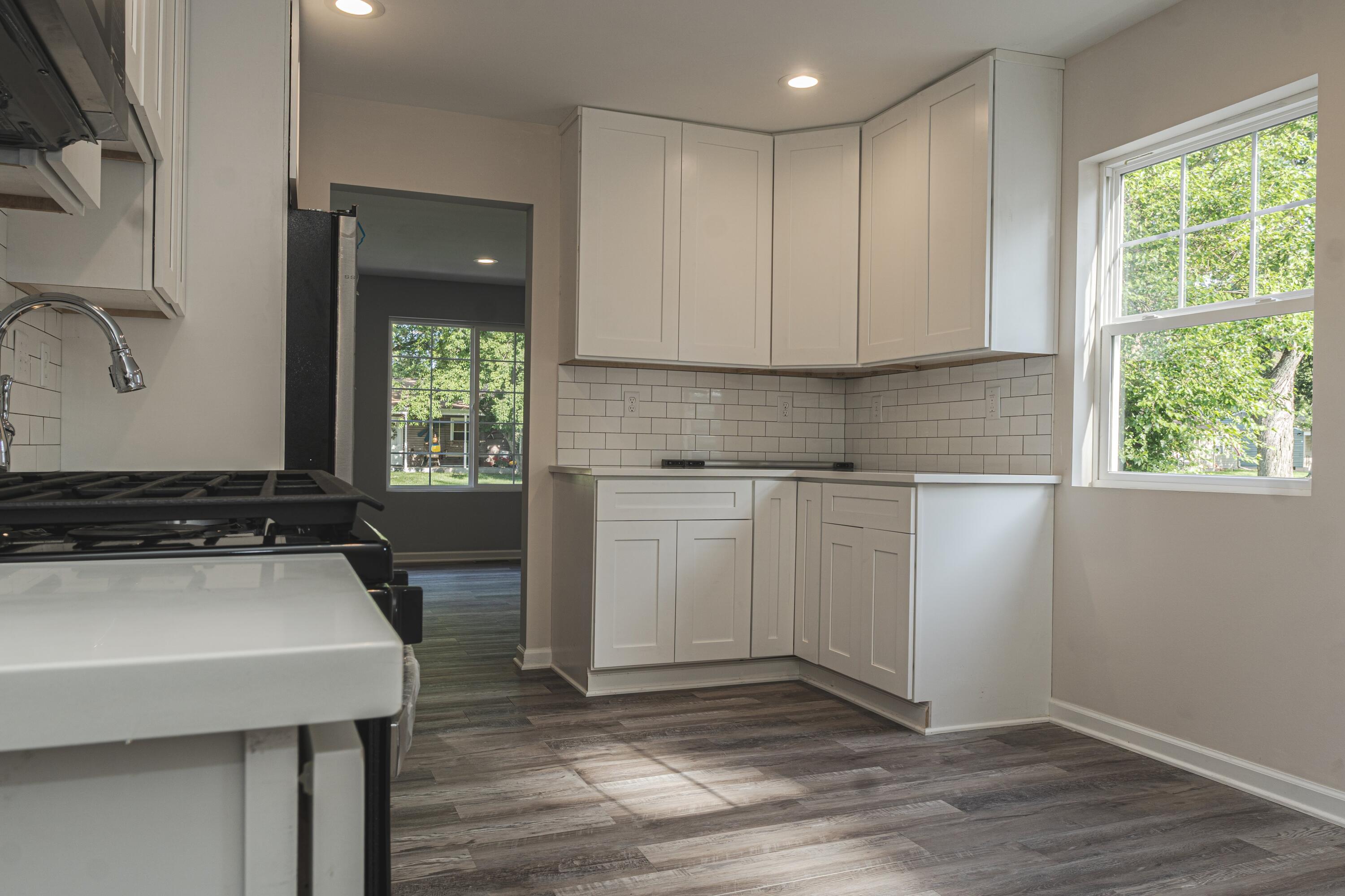 719 Imperial Road Valparaiso, IN 46385 - Photo 5 of 12 a kitchen with a sink cabinets and wooden floor