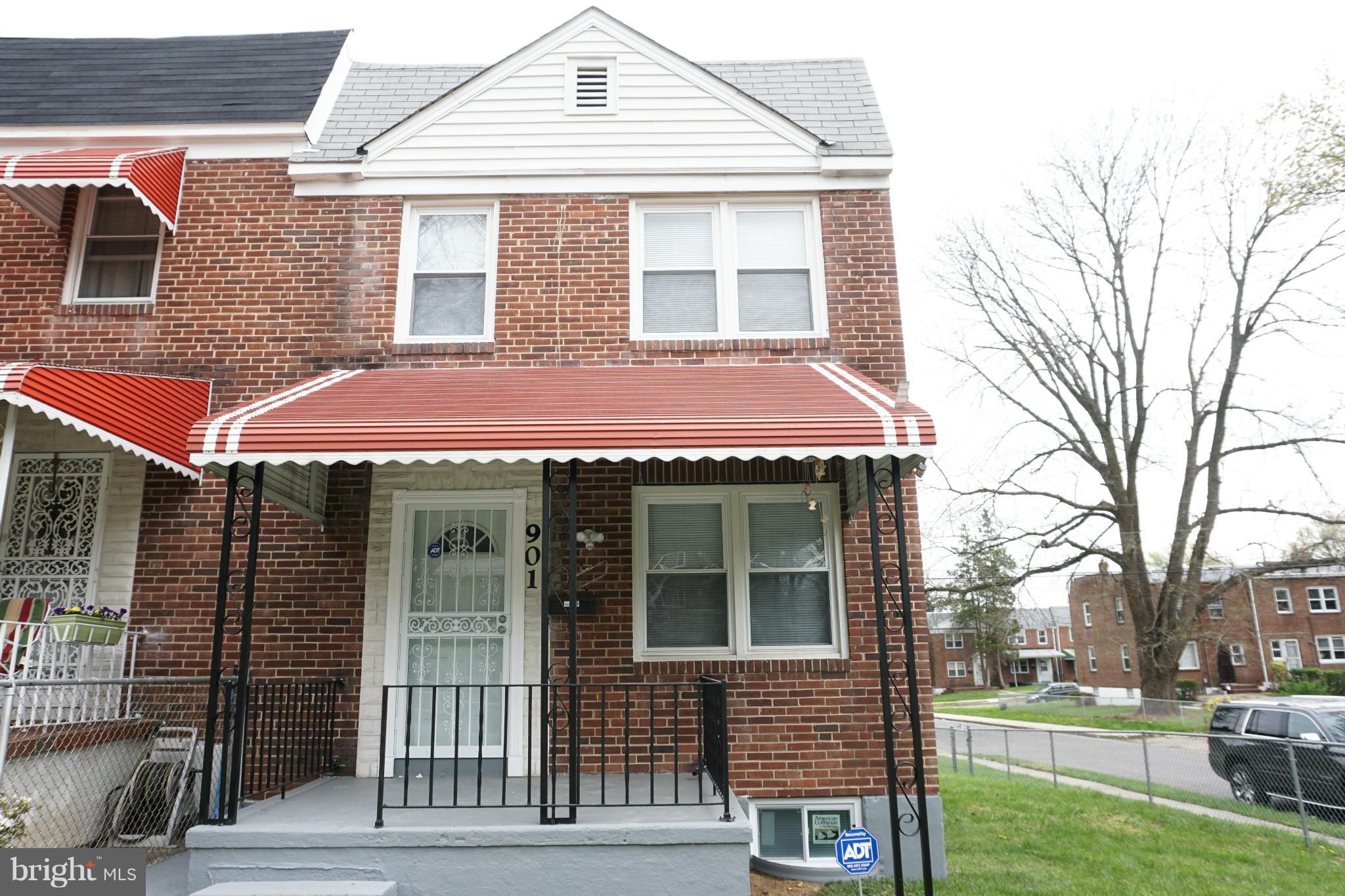 901 Wicklow Road Baltimore, MD 21229 - Photo 1 of 29 a view of a brick house with a large windows