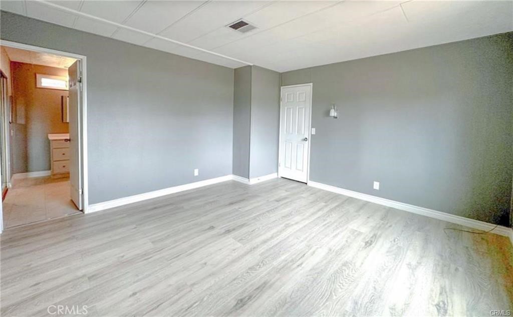 28160 Patterson Avenue Winchester, CA 92596 - Photo 17 of 57 a view of an empty room and wooden floor