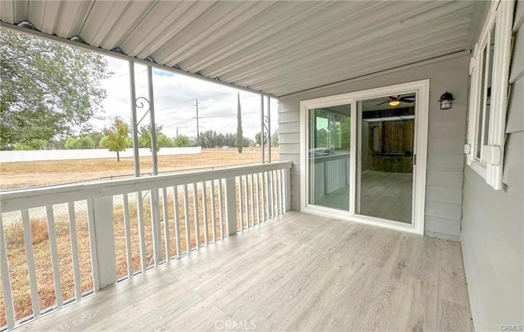 28160 Patterson Avenue Winchester, CA 92596 - Photo 25 of 57 a view of a porch with wooden floor and outdoor space