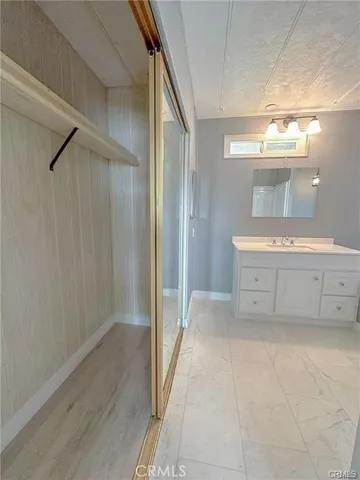a view of a kitchen with a sink and a stove top oven