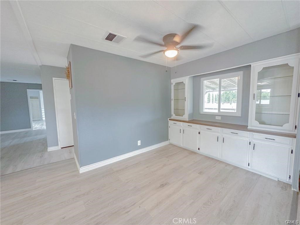 28160 Patterson Avenue Winchester, CA 92596 - Photo 37 of 57 a view of an empty room with window and wooden floor