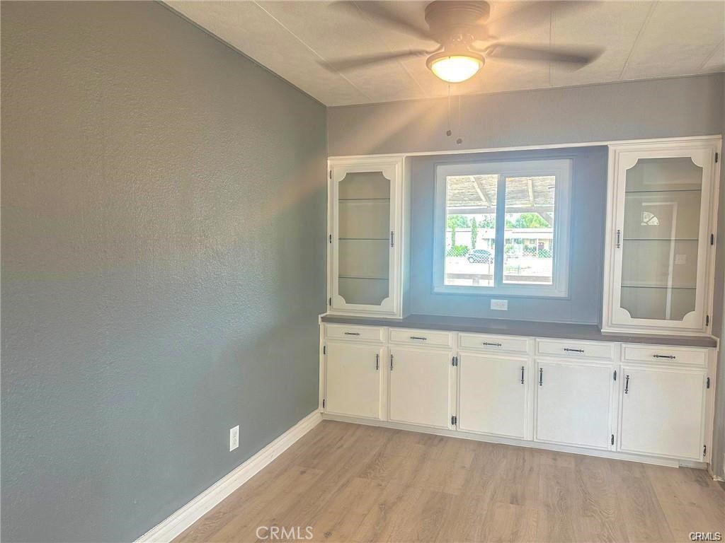 28160 Patterson Avenue Winchester, CA 92596 - Photo 40 of 57 an empty room with wooden floor and windows