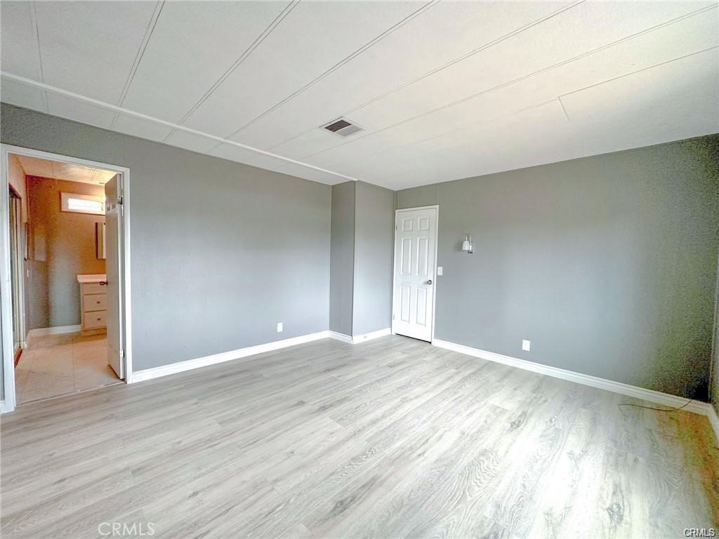 28160 Patterson Avenue Winchester, CA 92596 - Photo 42 of 57 a view of an empty room and wooden floor
