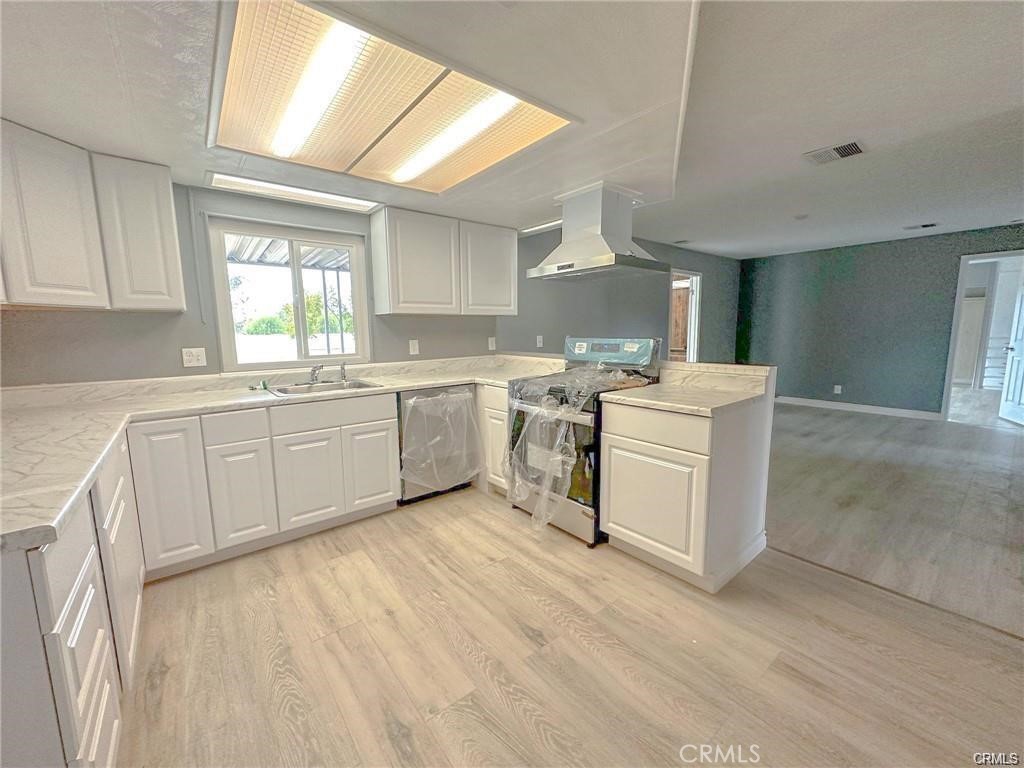 28160 Patterson Avenue Winchester, CA 92596 - Photo 43 of 57 a kitchen with a sink cabinets and window