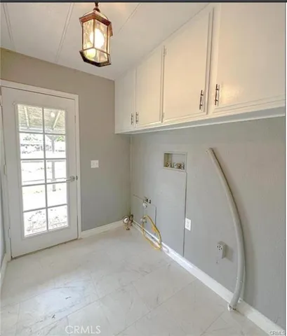 a view of bathroom with a sink and mirror