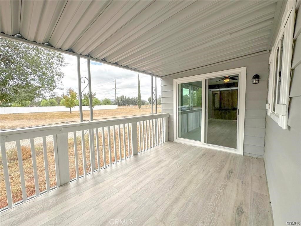 28160 Patterson Avenue Winchester, CA 92596 - Photo 51 of 57 a view of a porch with wooden floor and outdoor space