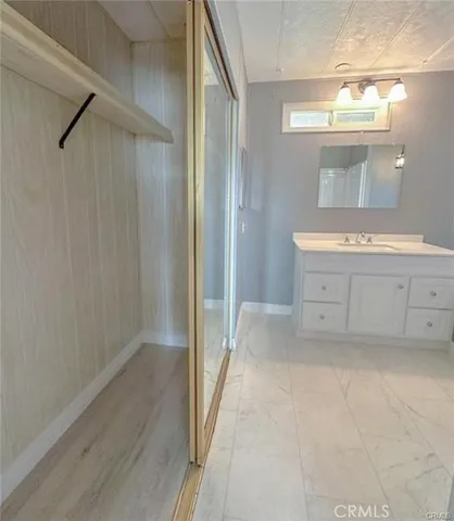 a bathroom with a glass shower door