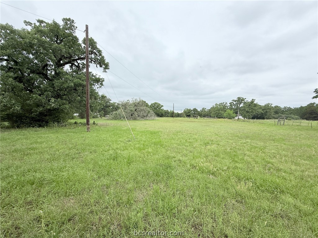 Tbd Wannabe Road Bryan, TX 77808 - Photo 17 of 25 a view of a green field with wooden fence