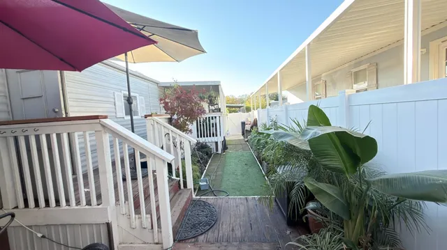 a view of a balcony with chairs