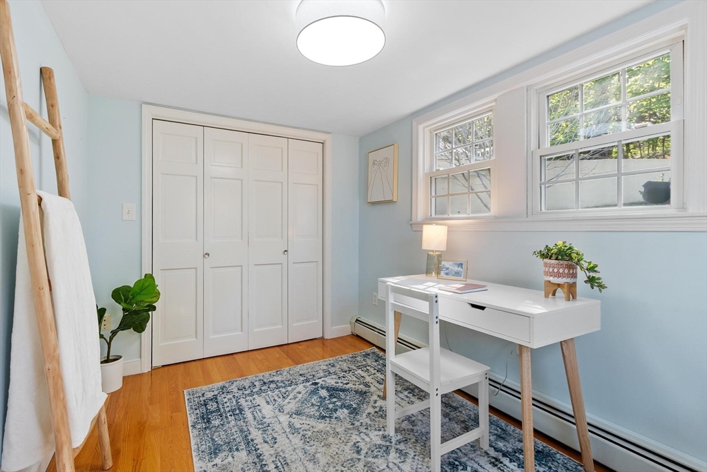 25 Naples Road Melrose, MA 02176 - Photo 9 of 36 a workspace with furniture and window