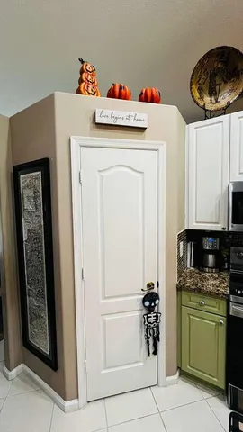 a white refrigerator freezer and a stove sitting inside of a kitchen