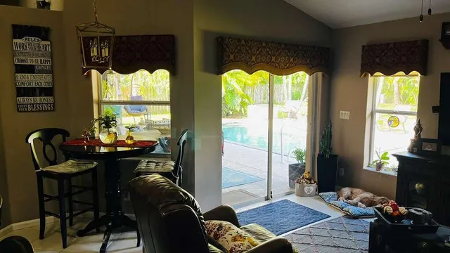 a living room with furniture fireplace and flat windows
