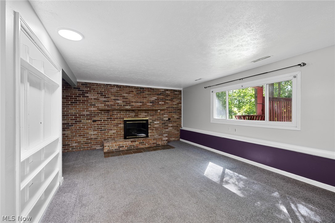 6720 Brookside Road Independence, OH 44131 - Photo 14 of 38 Wood burning fireplace in family room