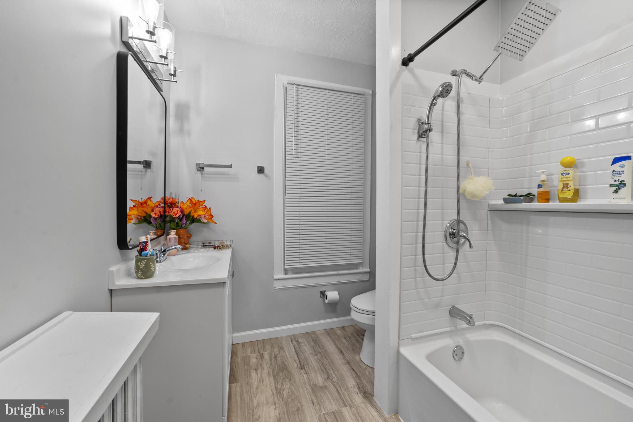2825 Kutztown Road Reading, PA 19605 - Photo 9 of 25 a bathroom with a sink mirror and shower