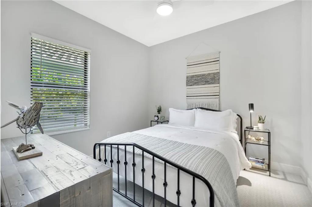 4621 Centaurus Circle Naples, FL 34120 - Photo 16 of 47 Carpeted bedroom featuring ceiling fan and baseboards staged for photo