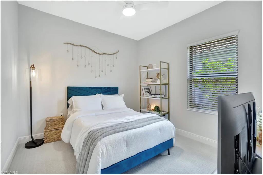 4621 Centaurus Circle Naples, FL 34120 - Photo 20 of 47 Bedroom featuring carpet and a ceiling fan staged for photo