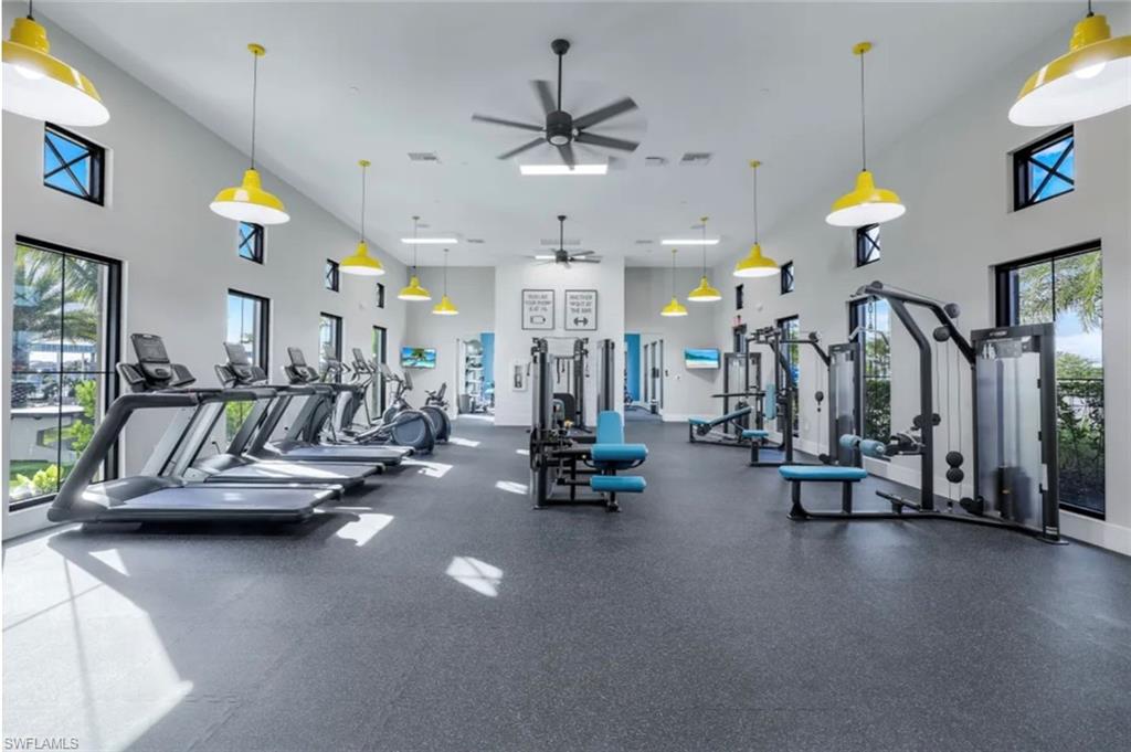 4621 Centaurus Circle Naples, FL 34120 - Photo 29 of 47 Gym featuring a towering ceiling and a ceiling fan