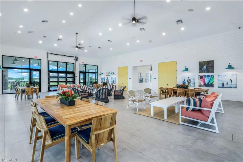 4621 Centaurus Circle Naples, FL 34120 - Photo 31 of 47 Dining space in Lakeouse featuring ceiling fan, a towering ceiling, and recessed lighting