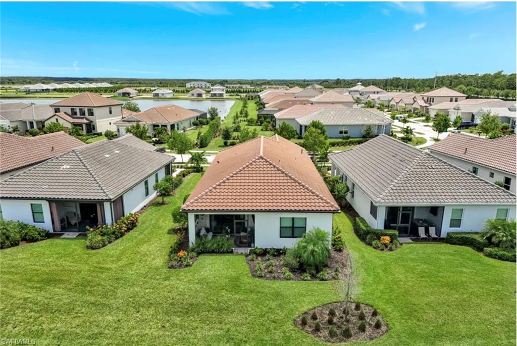 4621 Centaurus Circle Naples, FL 34120 - Photo 37 of 47 Aerial view of residential area with a nearby body of water