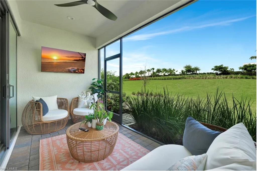 4621 Centaurus Circle Naples, FL 34120 - Photo 46 of 47 Sunroom with a textured wall staged for photo