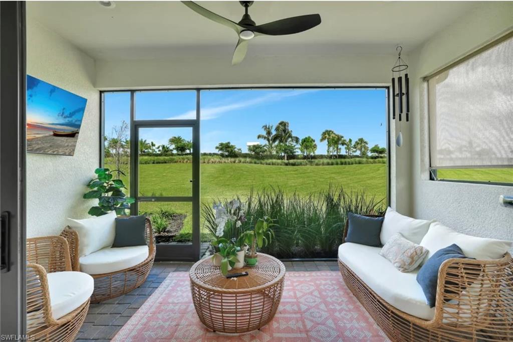 4621 Centaurus Circle Naples, FL 34120 - Photo 47 of 47 Sunroom featuring an outdoor living space and ceiling fan staged for photo