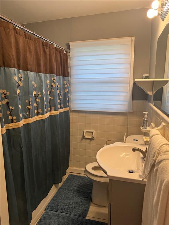 103 Wooten Drive Rome, GA 30165 - Photo 13 of 13 a bathroom with a sink a toilet and a mirror