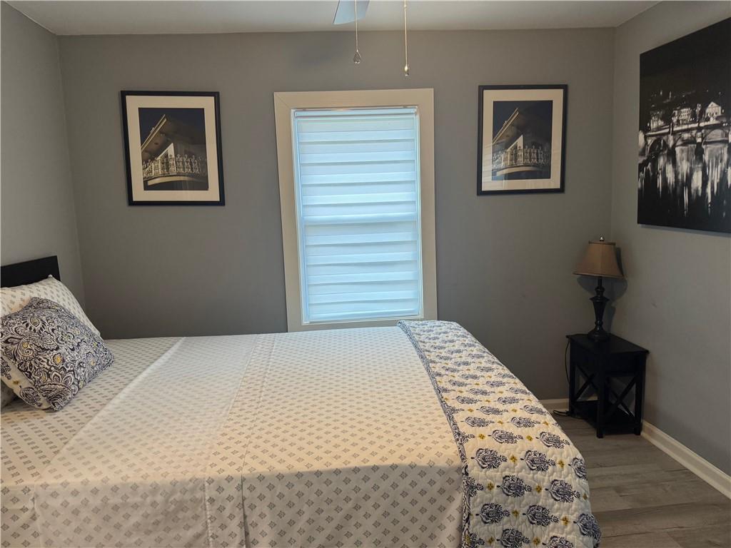 103 Wooten Drive Rome, GA 30165 - Photo 6 of 13 a bedroom with a bed and a painting on the wall