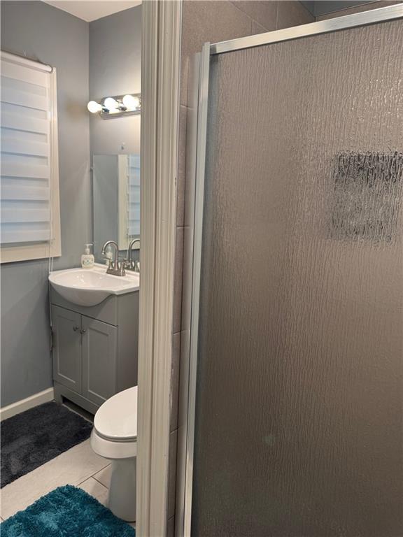 103 Wooten Drive Rome, GA 30165 - Photo 9 of 13 a bathroom with a sink a toilet and mirror