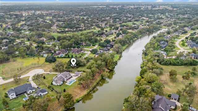 an aerial view of lake residential houses with outdoor space and lake view