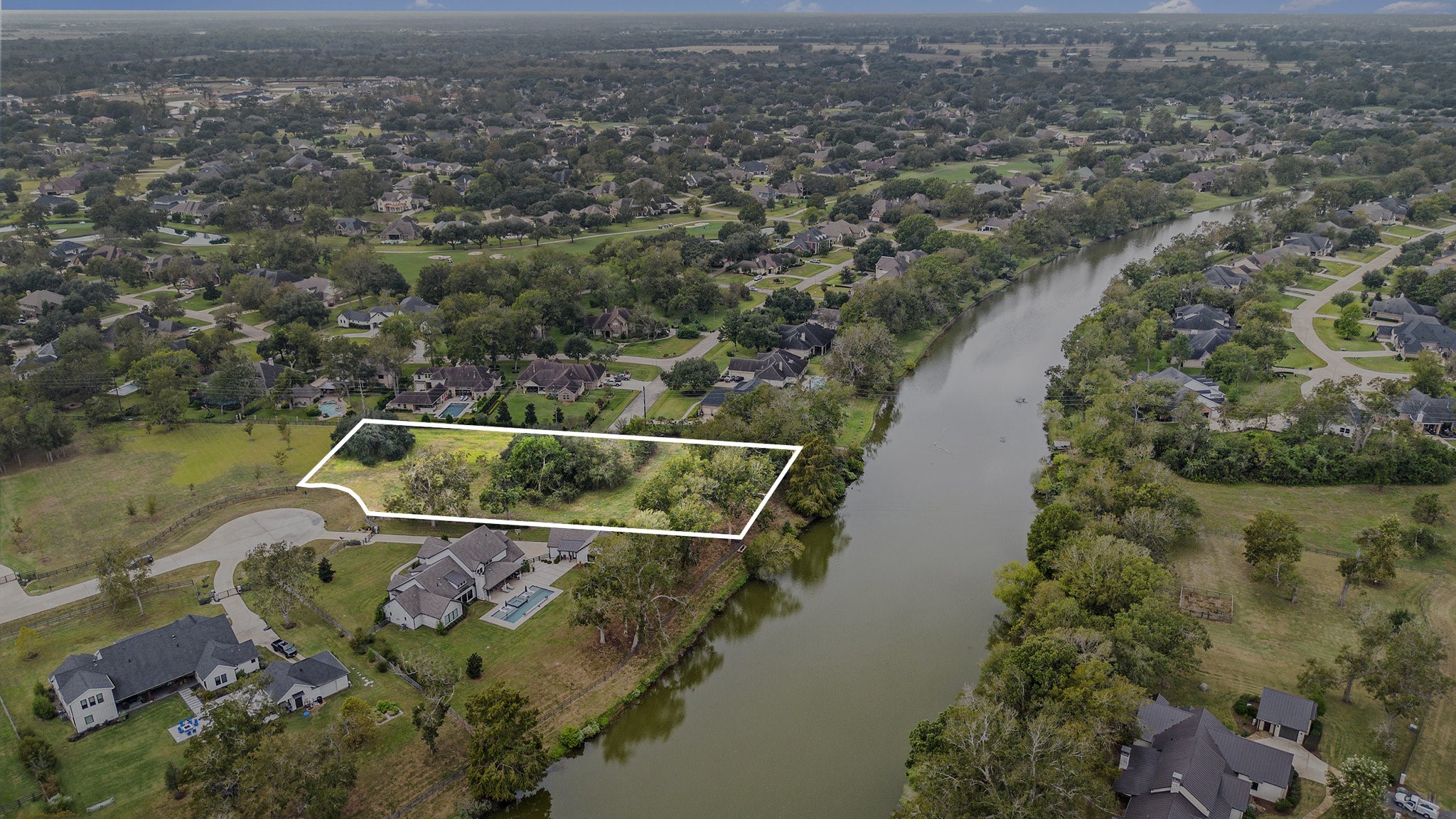 30703 Riverlake Road Fulshear, TX 77441 - Photo 4 of 15 an aerial view of a house with a lake view