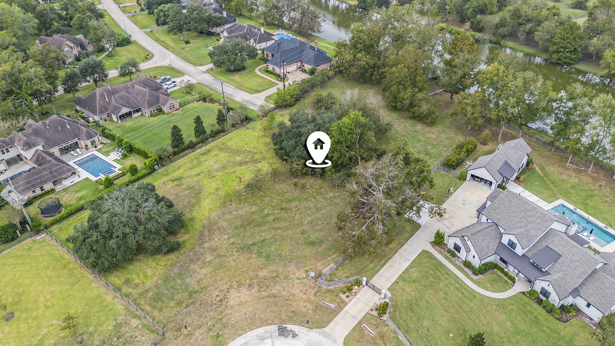 30703 Riverlake Road Fulshear, TX 77441 - Photo 5 of 15 an aerial view of a house with swimming pool and garden
