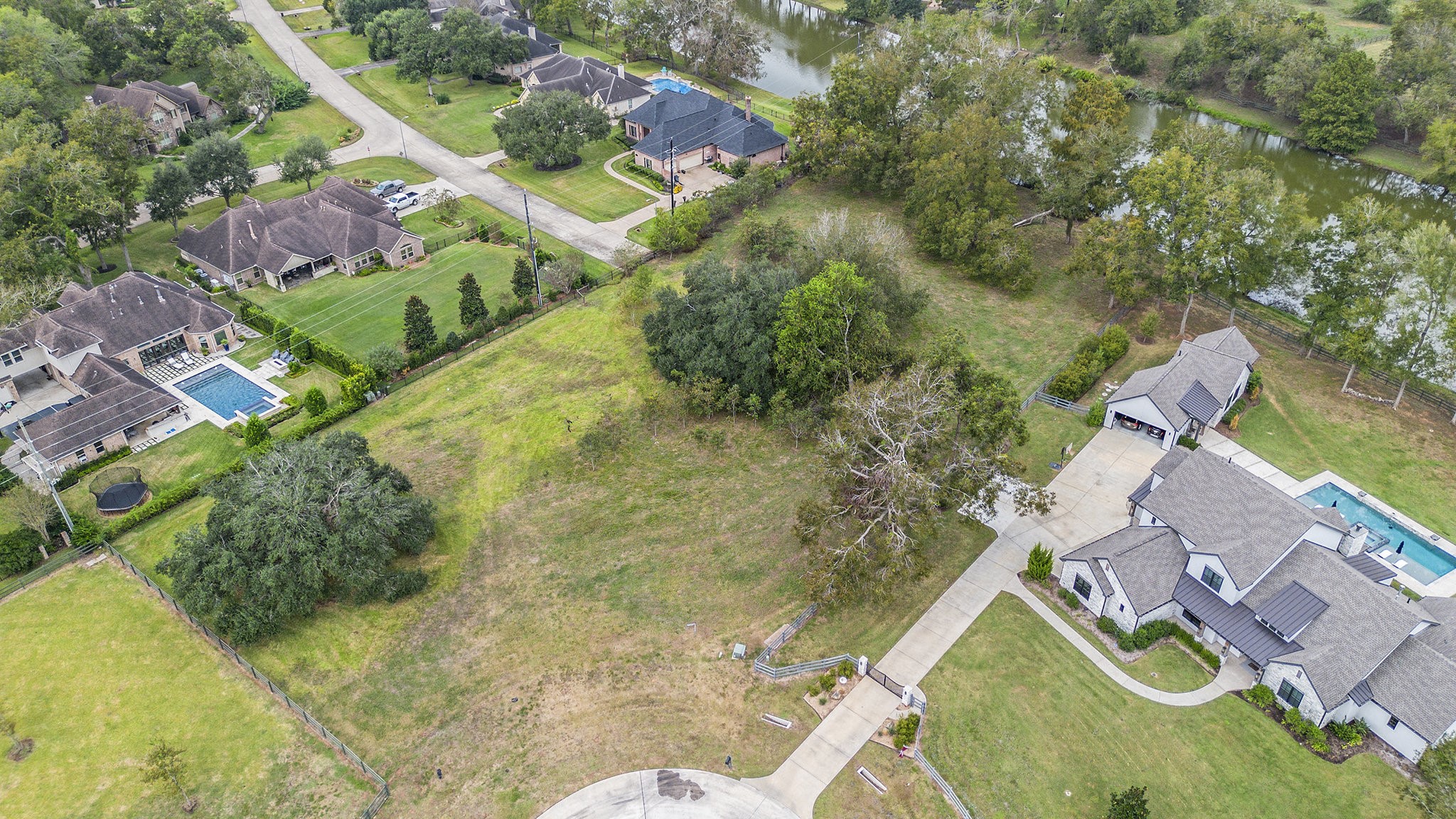 30703 Riverlake Road Fulshear, TX 77441 - Photo 9 of 15 an aerial view of residential house with outdoor space and swimming pool
