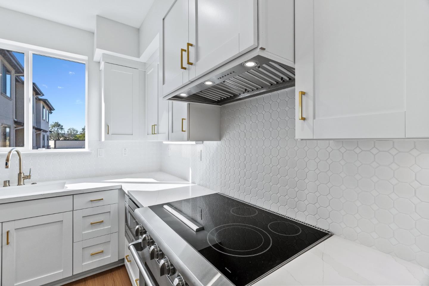 947 Woodside Road Redwood City, CA 94061 - Photo 12 of 51 a kitchen with a stove and a sink