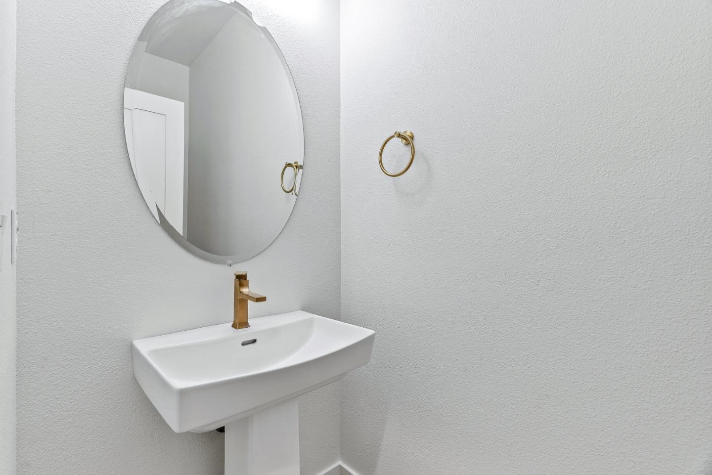 947 Woodside Road Redwood City, CA 94061 - Photo 13 of 51 a bathroom with a sink and mirror