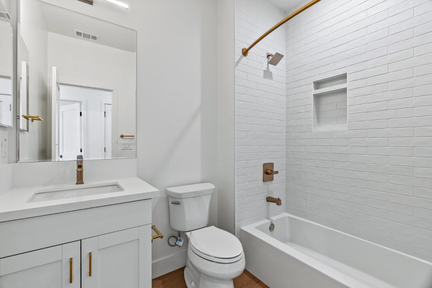 947 Woodside Road Redwood City, CA 94061 - Photo 18 of 51 a bathroom with a sink toilet and shower