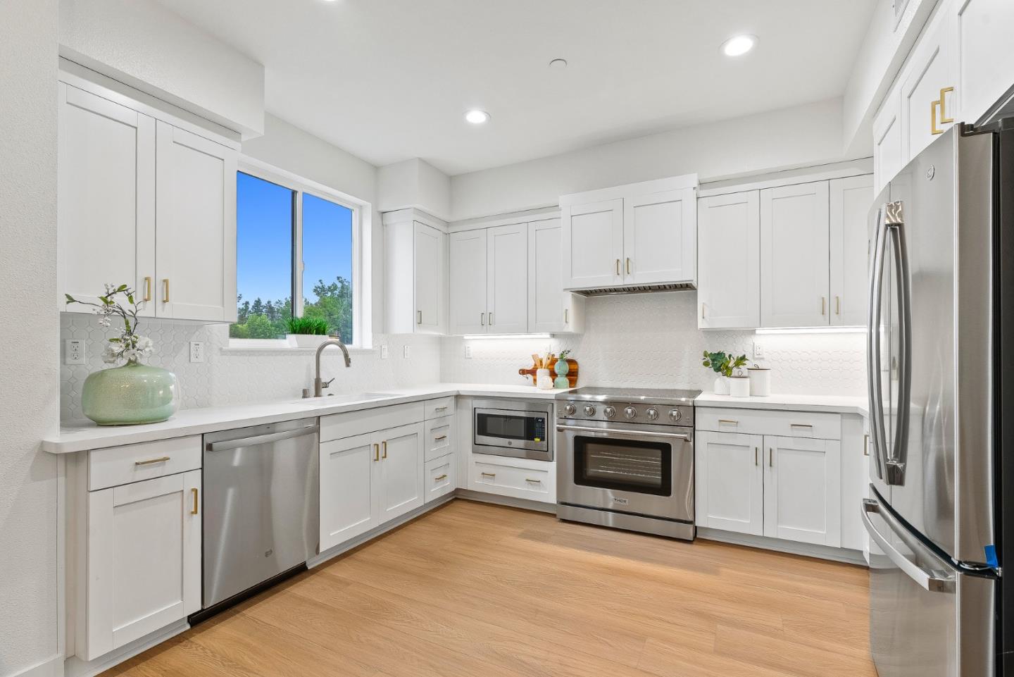 947 Woodside Road Redwood City, CA 94061 - Photo 38 of 51 a kitchen with white cabinets and white appliances